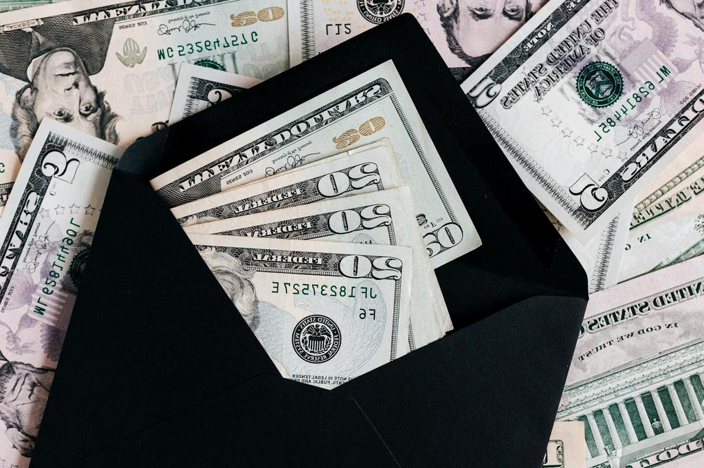 Traveler planning budget using a laptop