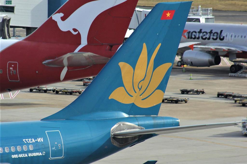 Traveler saving money using a piggy bank with travel items